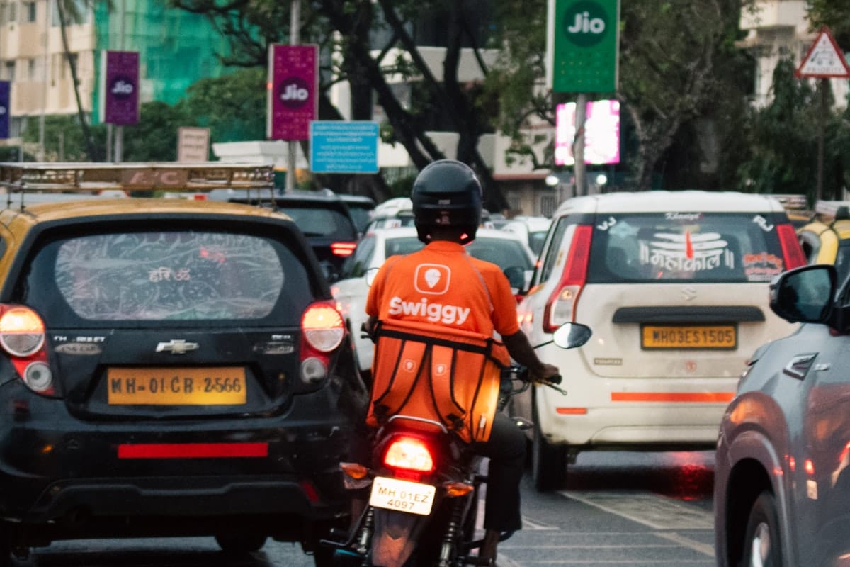 A transportation rider connected a motorcycle successful Mumbai traffic